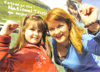 Suzanne in front of her 'Picture Yourself' billboard, alongside Maurica Lavery, Communications and Marketing Manager with The National Trust.