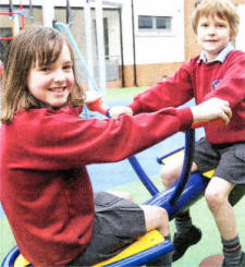 Trying out the play park at the new Pond Park Primary School. US1709-526CD