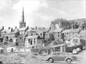 A view taken from a spot close to the banks of the River Lagan showing the rear of buildings in Bridge Street.