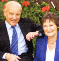 Secret's out at last - OBE recipient Terry Lappin and wife Gill. US2509-402PM