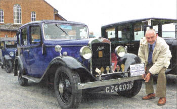 81-year-old George McCaig, a founder member of the club, with his 1933 Austin 12, a car he has owned since 1962 and which he bought for £15. 