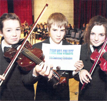 Part of the string group getting ready for An Evening of Christmas Music and Reflections 