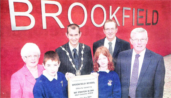 Maureen Rollins Chairman of Brookfield Primary School Board of Governers, Lisburn Deputy Mayor Edwin Poots, Principal Brendan Gillen and Santon Sloan Chief Executive SEELB pictured with Brookfield pupils Justin Locen and Kerry McClure at the opening of the new premises on Friday. US2309-102A0