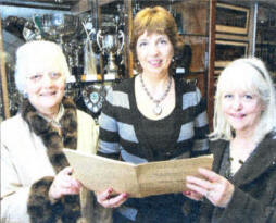 Former pupil Olive Tinsley (nee Henderson), one of the school's original intake in 1958, Mrs Margaret McCormick, vice principal, and Liz Brandon (nee Thompson), now living in England and also part of the first intake, looking through old school reports from 1958. US0509-502cd