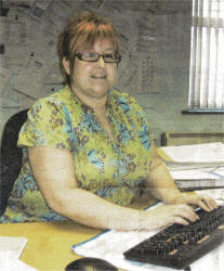 Ann Kerr back at her desk after her 'channel swim'.