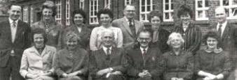 Lisburn Central Primary School Staff - June 1963. L to R: (front row) Miss Bell (Mrs Clarke), Miss Bowden, Mr Matt Shields (Principal), Mr David Thompson (Vice Principal), Miss McCrory and Miss Brown (Mrs Cochrane). (Back row) Mr Derek Allen, Mlss Mcllroy, Mrs Taylor, Mrs Monteith, Mr Robert Cairns, Miss Corbett, Miss Johnston and Mr W J Strain.