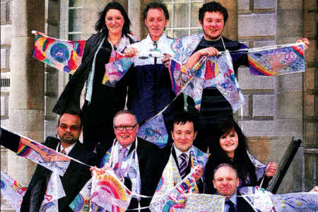 Lisburn City Council's Good Relations Officer David Mitchell (front row, far right) and alr David Archer (front row, third right) join Tony McCusker Community Relations Council Chairman at the launch of Community Relations Week at Belfast City Hall