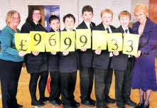 Mrs Collins, left, and Mrs Ann Walker MBE, chief executive of Action MS, with a group of pupils from Fort Hill College who raised money for the charity last November by taking part in a sponsored walk.