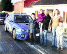 The Fletcher family outside their home in Moira