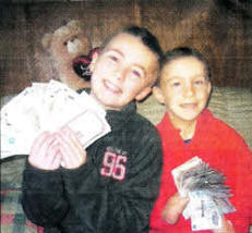 Brian Kerr and Adam Fletcher count the money following the fund raising event at the Maze Presbyterian Church Hall