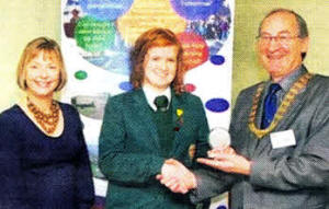 Friends' pupil Kerry Logan being presented with the prestigious Youth Leadership Development Award. Included is Anne Roulston, president of the Rotary Club of Lagan Valley.