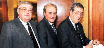 Maurice Leathem (Guest of Honour) signs the visitor's book in the Mayor's Partour. Looking on are Ken Murphy (Chairman) and Robert Loyal (Secretary).