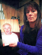 Margaret Partidge with a picture of her husband Eric. Right