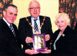 Harry Shortt (Chairman) and Pearl Finn (Secretary) pictured presenting a copy of 'Beloved Of My Heart - Little Hillsborough Town' the Mayor, Councillor Allan Ewart.
	