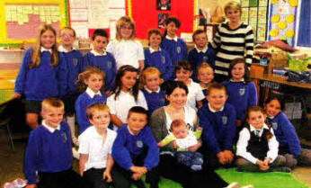 Baby Conor and his mum Helen, visit the classroom at Tonagh Primary where 
	trained Roots of Empathy instructor, Lynda Tavakoli, gathers the children 
	around as they watch Conor grow and develop.