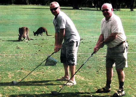 Bobby Watson with son Raymond playing golf in Perth.