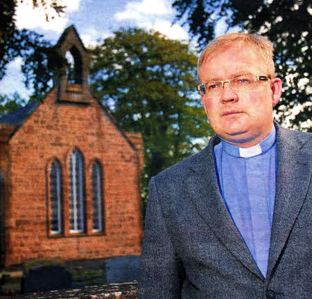 Rev David Pierce outside St John's Parish Church, Hlllsborough, which was robbed- US3810-569cd