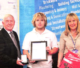 South Eastern Regional College Refrigeration Apprentice Stuart Millar is presented with his prize after claiming the gold medal at the SkillFRlDGE UK National Finals