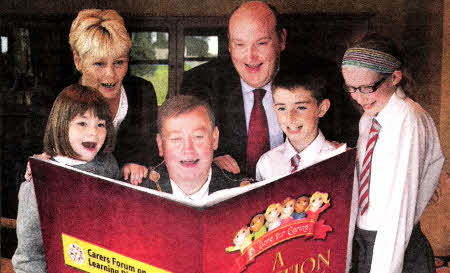 The Mayor, along with daughter Hollie and Primary 7 pupils from Fort Hill Integrated Primary School; Mark Leitch and Hannah Kirkpatrick, launch the Mayor's Poetry Competition called 'A lime for Caring'.