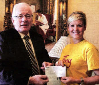 Former Mayor of Lisburn, Councillor Allan Ewart presents a cheque to Mrs. Samara Prentice of TinyLife, which was the former Mayor's Mayoral charity