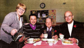 Sylvia Eskins is pictured providing refreshments for 90 year old war veteran John Leishman as he shares some of his wartime stories with the Rev Paul Dundas (left) and the Rev John Pickering (right) at the Coffee Morning in Christ Church Parish, Lisburn