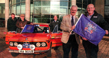 Councillor Thomas Beckett, Chairman of the Council's Leisure Services Committee at the launch of the 2011 Retro Rally which will start in Lisburn today (Friday) with Ronnie Mitchell, organiser. Looking on alongside one of the cars competing in the rally are (l-r)Aaron Mitchell, Clerk of the Course; Conn Williamson, competitor and Chris Livingstone, Deputy Clerk of the Course.