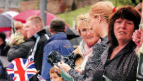 Watching the Royal lrish Regiment parade through Lisburn. US2111-54Ocd