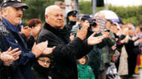 Applause for the Royal Irish Regiment as the parade through Lisburn gets underway. US2111-565cd