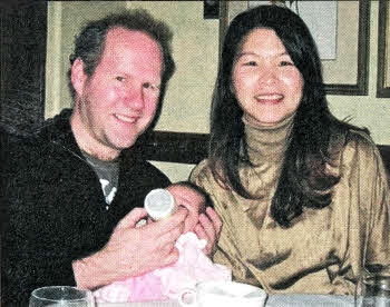 Lisburn man Brian Hamilton with his wife Lisa and daughter Beatrix.