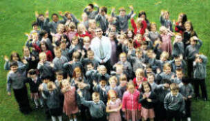 Fort Hill Integrated Primary School Principal John Walsh pictured with pupils on his retirement. US2611.11OAO