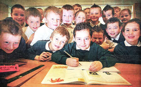 Joshua Fletcher is welcomed back to Meadow Bridge Primary School this week by his classmates. US0811-112A0