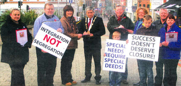 Parents and children from Knockmore Primary school were joined by the Mayor of Lisburn Cllr Brian Heading, Ald Paul Porter and Cllr Jonathan Craig MLA as they asked shoppers to sign their petition to save Knockmore Primary School.