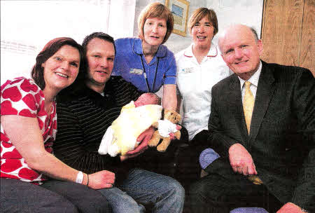 Kerry and Allan Houston with Baby Adam, Lynne Logan (Team Midwife), Sarah Rankin (Team Leader) and Michael McGimpsey (Health Minister)