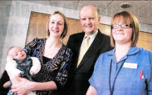 Karen Cooper and baby Ellen with Health Minister Michael McGimpsey and Staff Midwife Ashley Johnston. Baby Ellen was first baby to be born in the unit when it opened five weeks ago.