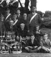 Stewart, second from right in the second row back with his father behind him on his left in the band uniform