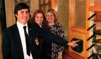 Head Boy Matthew Ballantyne, Head Girl Jenny McDowell and Vlce Chair of the Wallace PTA Mrs. Julie Dumigan using the new biometrlc registration system for Year 14 pupils at the school.