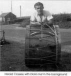 Harold Crossey with Dick's Hut in the background.