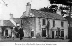 Canon and Mrs Mitchell stroll in the grounds of Wellington Lodge.