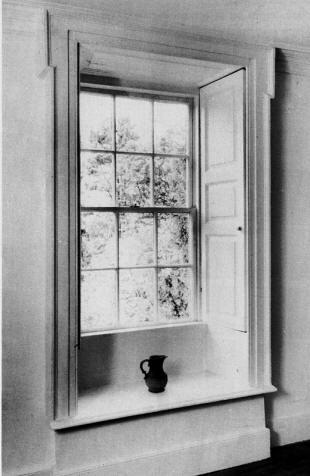 Fig. 2. A typical 18th century window, with lugged architrave, panelled shutters and window seat.