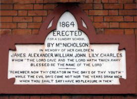 Stone panel above the church hall door at Christ Church.