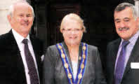 Deputy Mayor Councillor Margaret Tolerton is welcomed to the official opening of the new church hall facilities at Hillsborough Presbyterian by Derek McClelland (left) and David Workman (right).