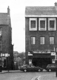 Time for the choristers to change the 'canary song' outside the old Menary's store, which has now made way for the City's Post Office.