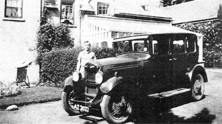 Hal Downer at his stepmother's house at Chrome Hill, Lambeg. The 'AZ' lettering in the vehicle registration number was issued to vehicles in Belfast City from 1928. 
						US3707-DOWNER1