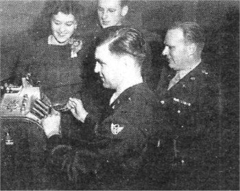 Playing the slot machines at Langford Lodge in 1943. Myrtle and her future husband Richard look on. Myrtle would later use winnings to purchase material for her weddng dress.