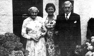 William and Sarah McMaster outside their home at Nettlehill Road, Ballymacash, Lisburn with Maisie Richardson (centre). William had been the caretaker of the Ulster Tower at Thiepval, France after it opened in 1921.