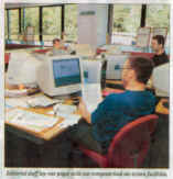Editorial staff lay out pages with our computerised on - screen facilities