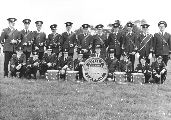 Quilly Temperance Flute Band pictured in June 1969 wearing new uniforms, the introduction of which could be attributed to the late Mr. George McCandless. L to R: (back row) Bobby Hull, Bobby Skelton - Bandmaster, Jack Wilson (decd), Geordie Clydesdale (decd), Raymond McKnight, Ronnie McCandless, Kenny Martin, Tom Davidson, Bobby McKitterick (decd), Alan Clydesdale (decd) and Hector McCauley. (front row) Norman McCauley, John Hill, Artie Beattie, Elizabeth Knox, Jim Hamilton, Ivor McCandless, Elizabeth McCauley, Jim McCauley, Trevor Hamilton and Stephen Sands.To the best of our knowledge, the late Geordie Clydesdale (4th from left) was the fife player at Quilly in the pre-band days (early 1950's).)