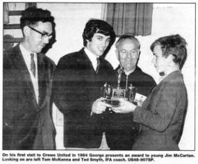 On his first visit to Crewe United in 1964 George presents an award to young Jim McCartan. Looking on are left Tom McKenna and Ted Smyth, IFA coach. US48-907SP.