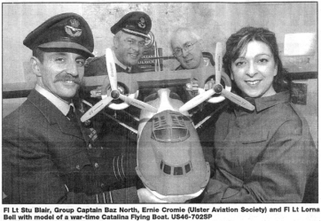 Fl Lt Stu Blair, Group Captain Baz North, Ernie Cromie (Ulster Aviation Society) and FI Lt Lorna Bell with model of a war-time Catalina Flying Boat. US46-702SP 