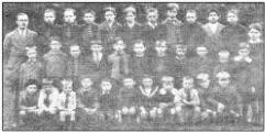 The boys of Newport Primary School and the Principal, Mr JJV Boyd in 1923. From left to right, back row: S Acheson, J Mercer, J Brooks, L McQuiggan, S Alexander, J McFarlane, S Hewitt, J Palmer, T Finlay, T Kane, C Donaldson. Middle Row: J Hewitt, T Mercer, A Acheson, A Murphy, H Mercer, G McCord, T Castles, T Morgan, J Sinnerton, E Kane, Bobby Walker. Front Row: W Hall, R Doherty, N Doherty, J Chapman, D Chapman, C Freel, R McCandless, B McCarthy, S Castles, H McCarthy, W McCarthy. US21763SP